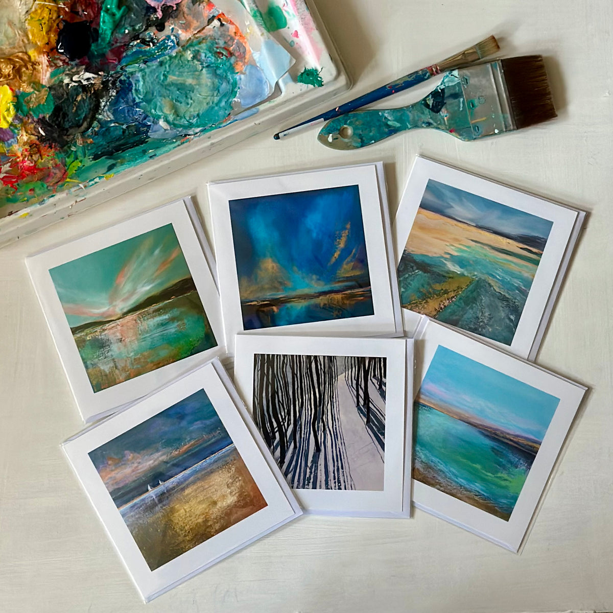 Set of 6 art cards featuring paintings by Helen Wooldridge - south west England based artist inspired by nature and landscape. Six cards of different designs laid out together 